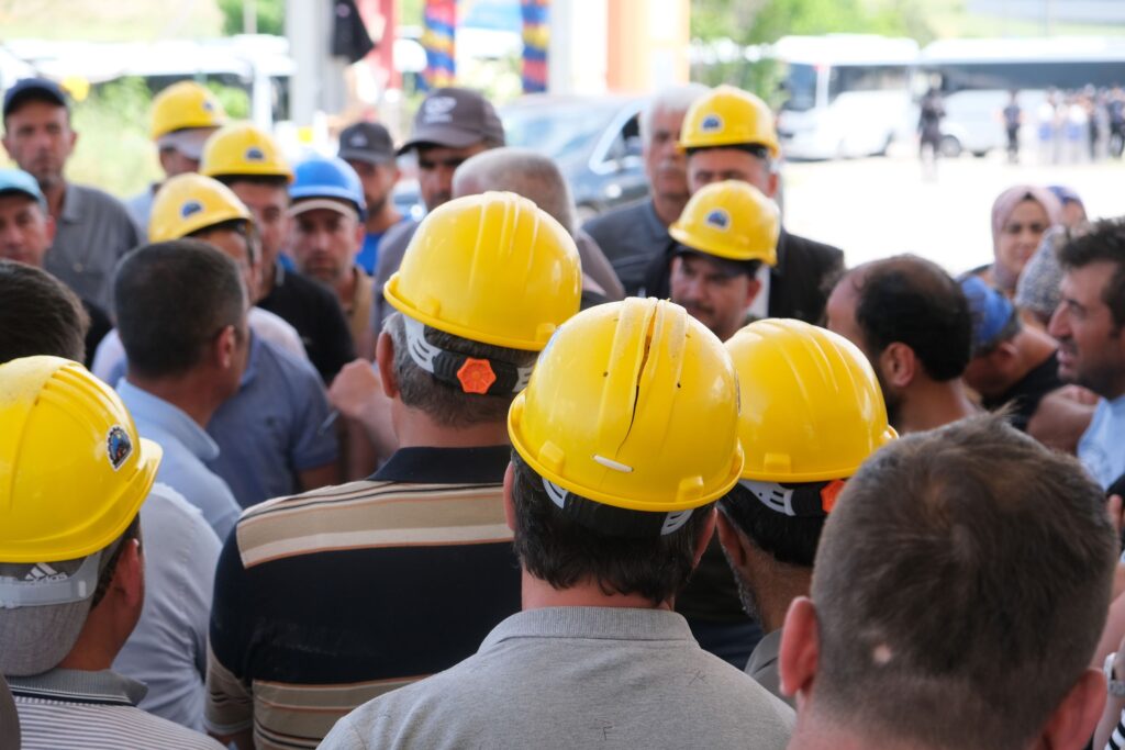 Willert Construction crew in hard hats reviewing a project on site