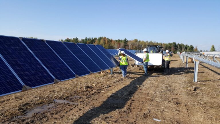 Crew installing solar panels, Willert Construction